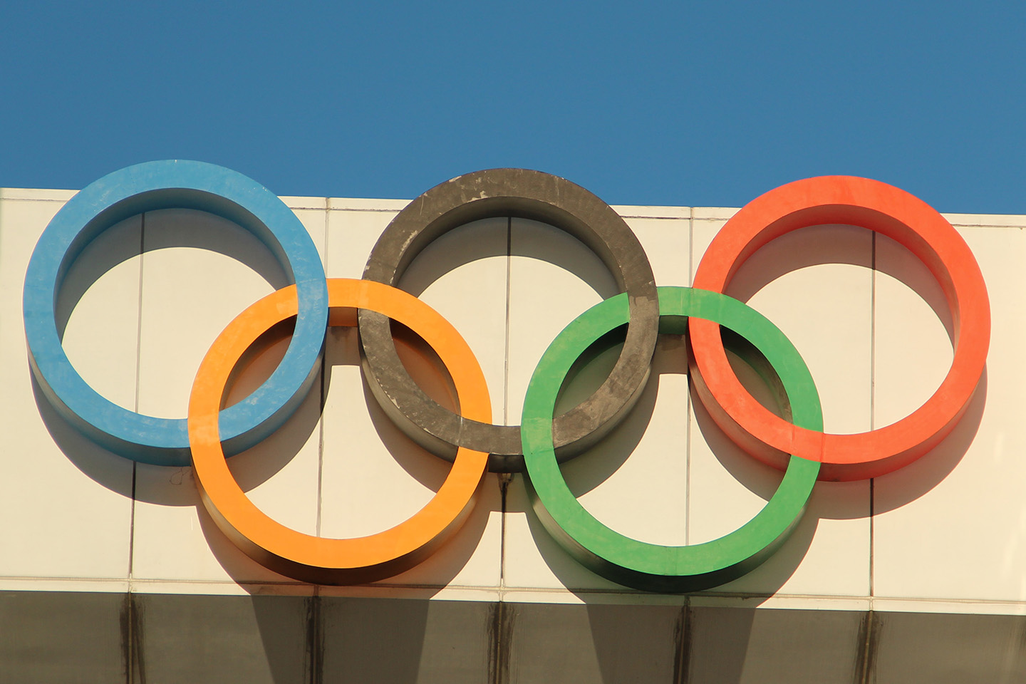 Close up of the Olympic rings on a building 