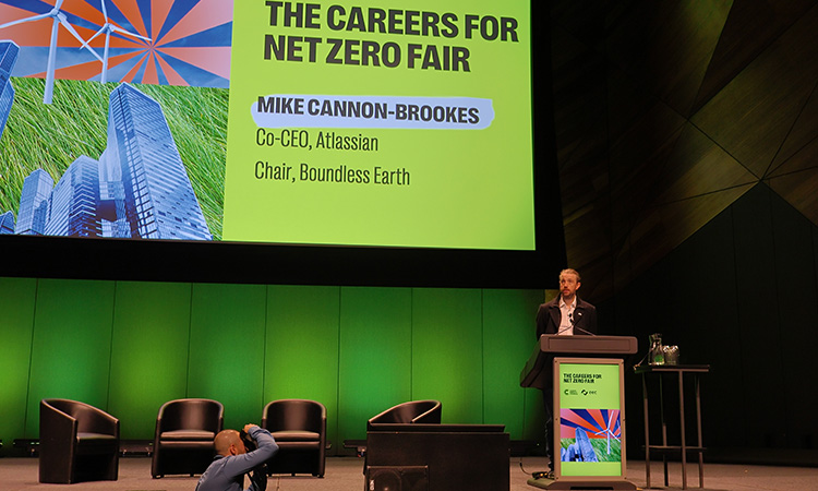 Image of Mike Cannon-Brookes on stage presenting at the careers for net zero fair